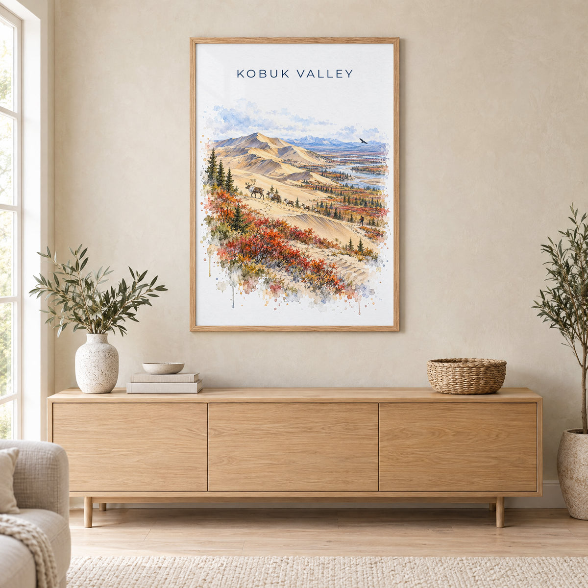 Kobuk Valley National Park watercolor print in an oak frame above a light wood sideboard in a Scandinavian living room