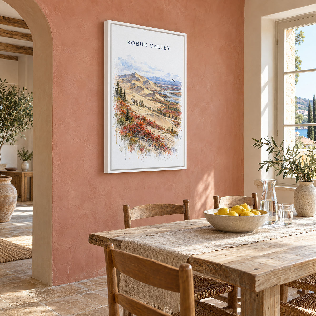 Kobuk Valley National Park watercolor print as a white floater canvas on a terracotta wall above a rustic dining table