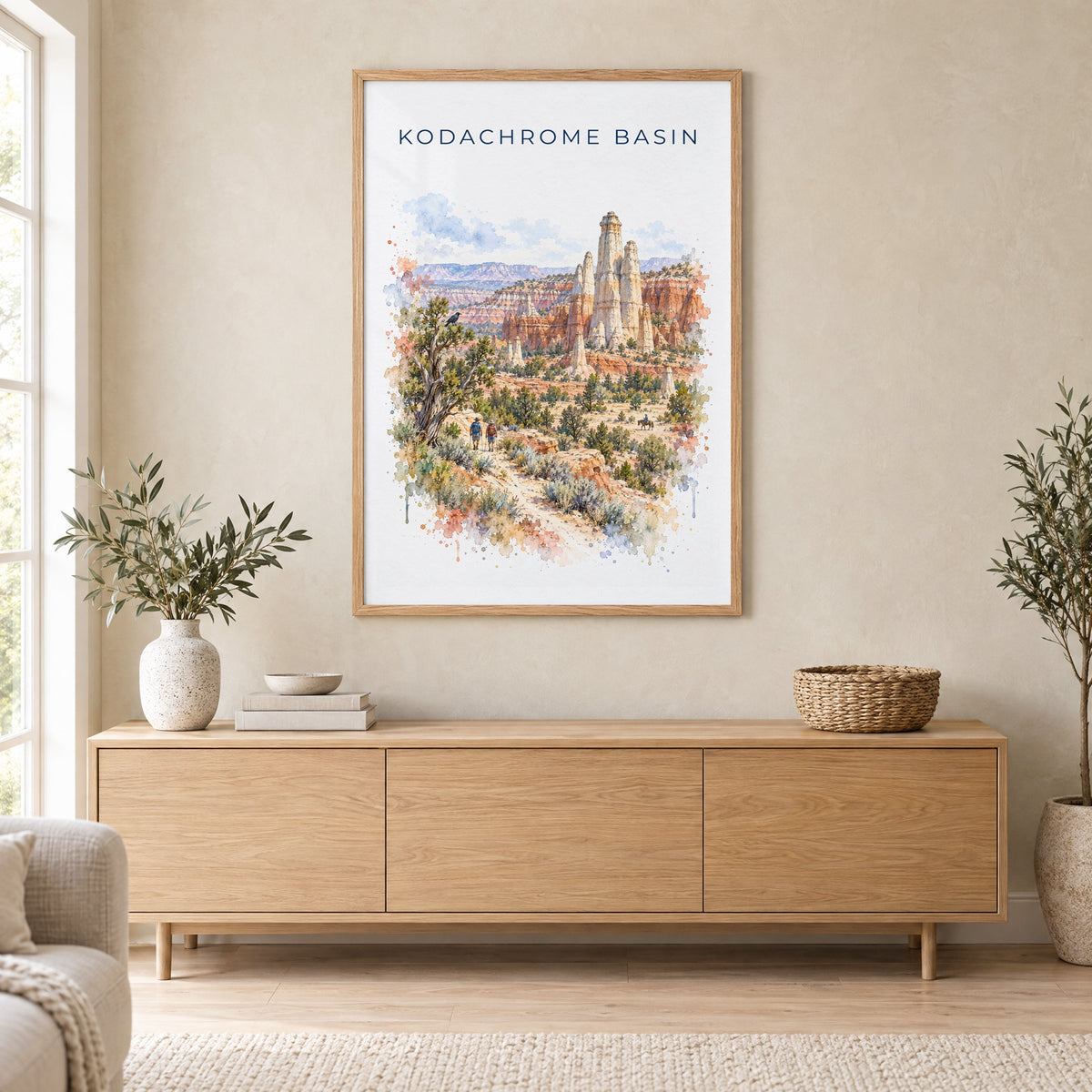 Kodachrome Basin State Park watercolor print in an oak frame above a light wood sideboard in a Scandinavian living room
