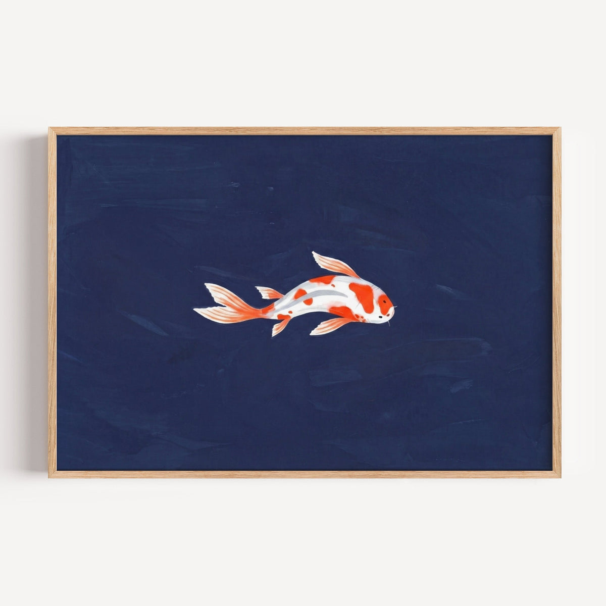 Koi fish on navy print in a light oak frame on a plain white wall