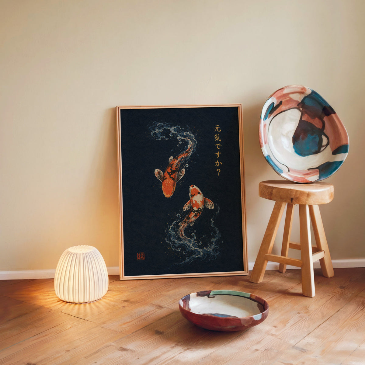 two koi fish on navy print in a light wood frame leaning on a wooden floor by a glowing lamp and stool