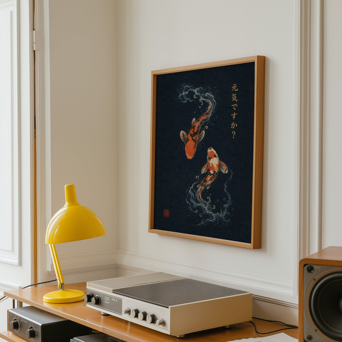 two koi fish on navy print in an oak frame above a vintage hi-fi shelf with a yellow desk lamp