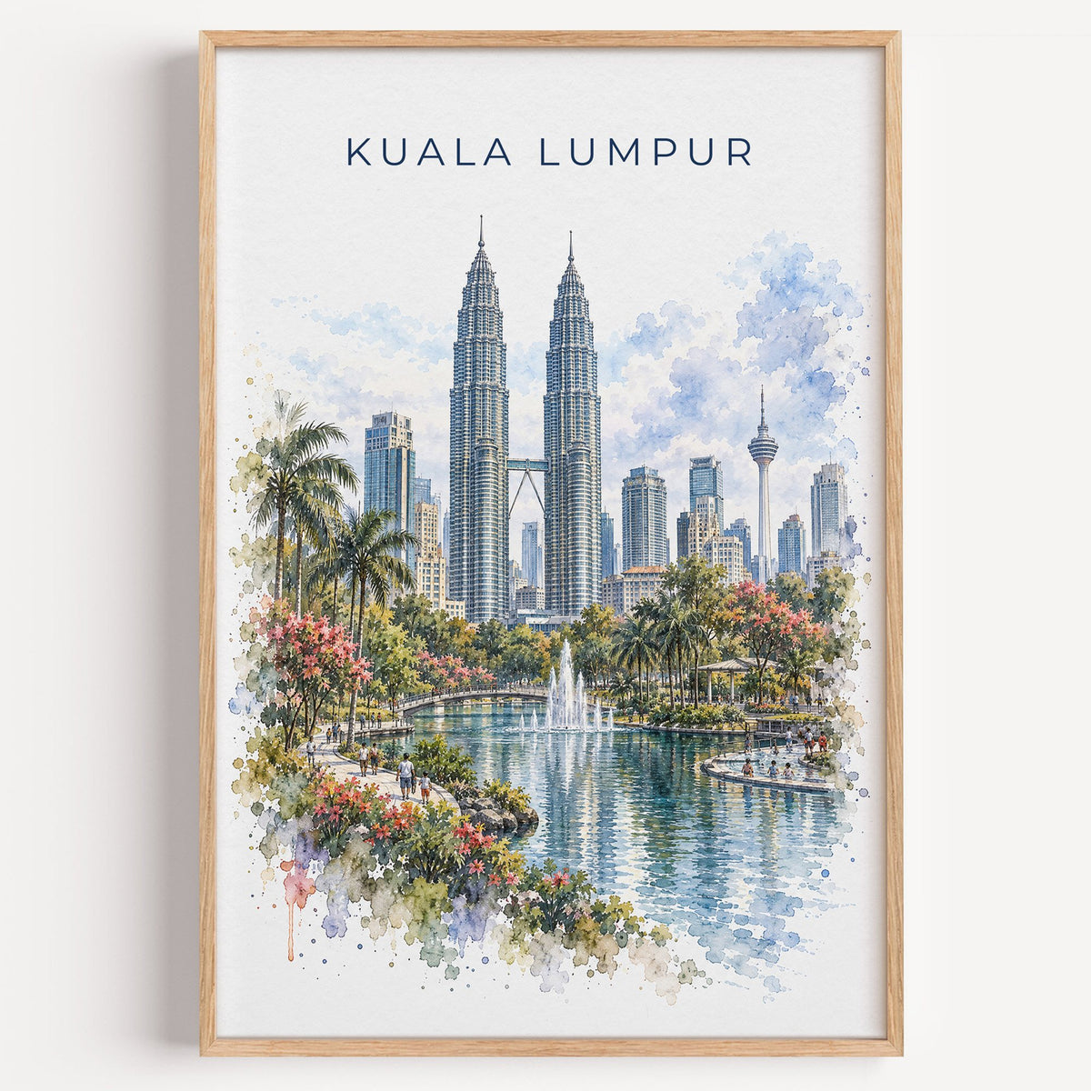 Kuala Lumpur watercolor print in a light oak frame on a plain white wall