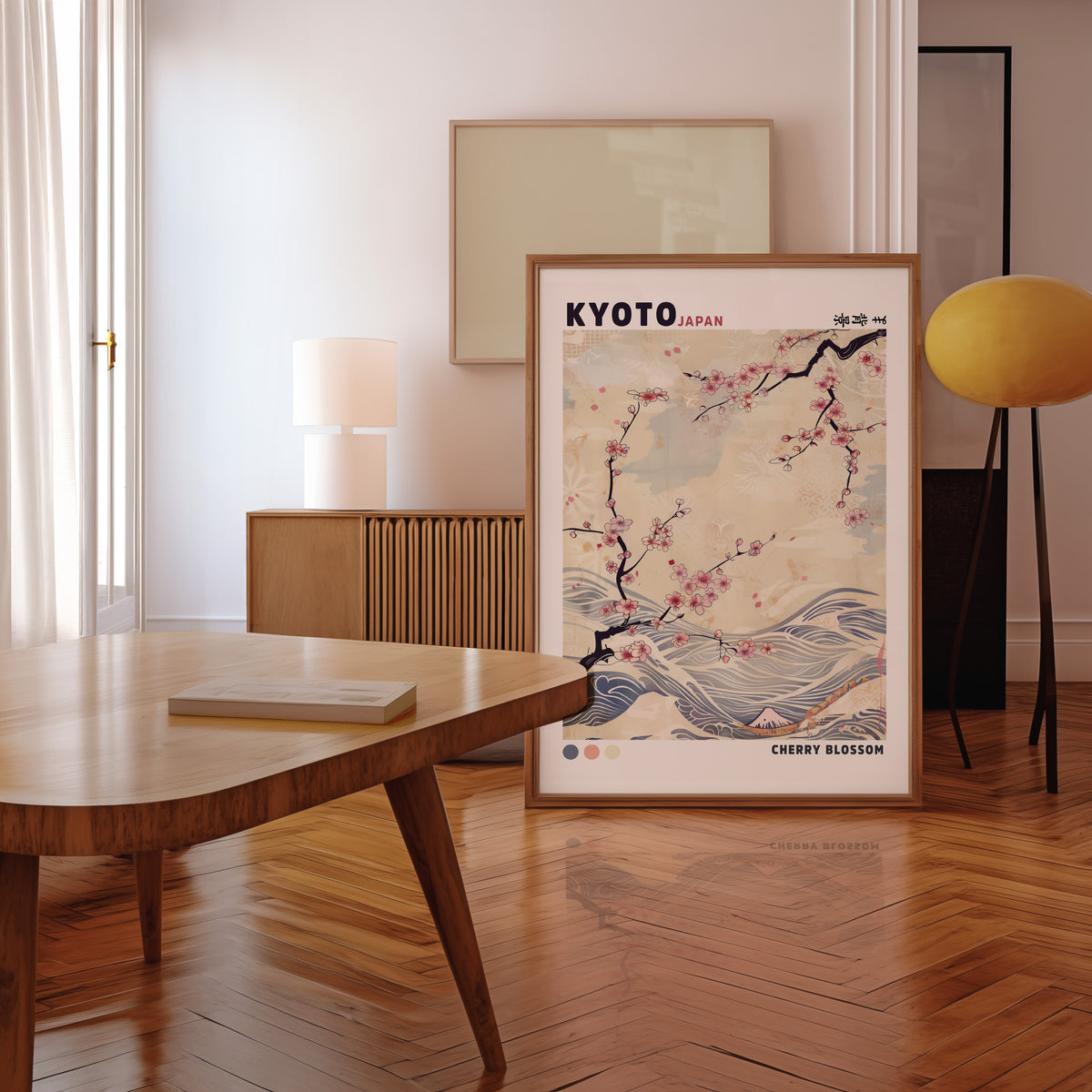 Kyoto cherry blossom and waves print in a walnut frame leaning in a mid-century living room