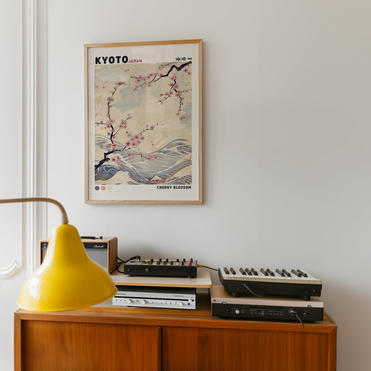 Kyoto cherry blossom and waves print in an oak frame above a teak sideboard with vintage hi-fi