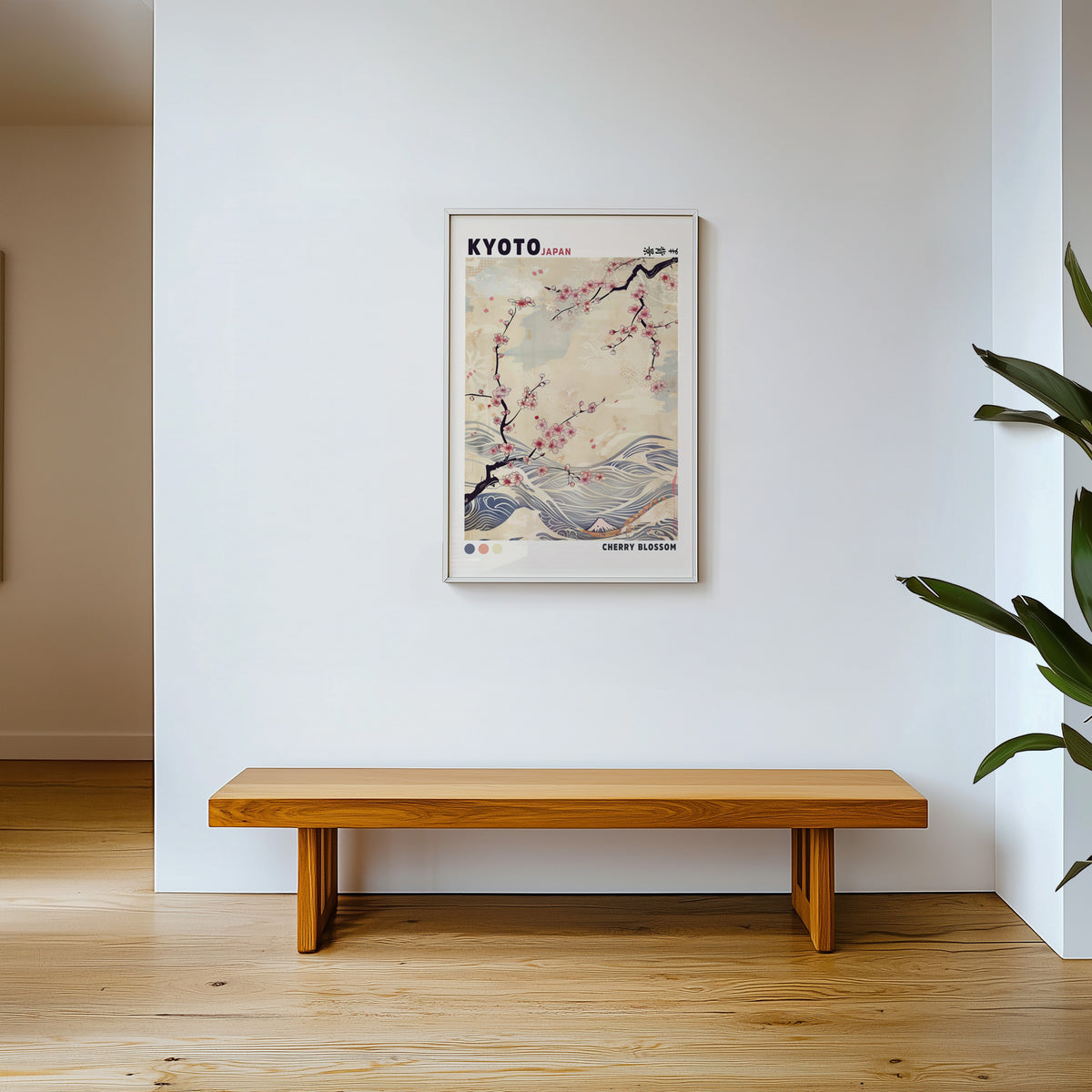 Kyoto cherry blossom and waves print shown in a white frame above a wooden entryway bench