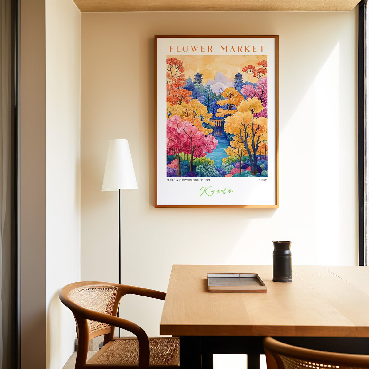Kyoto flower market print in an oak frame above a dining table and cane chair