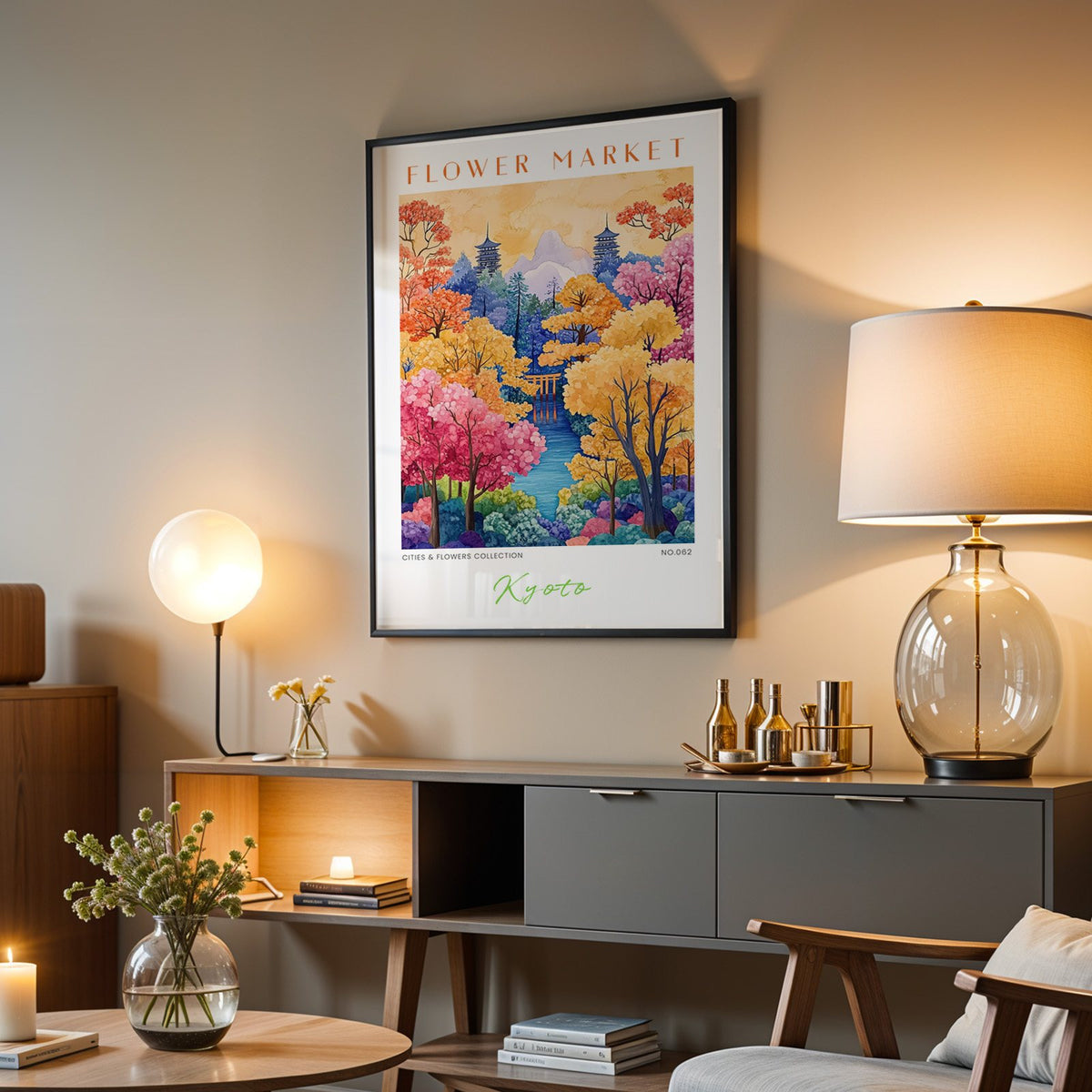 Kyoto flower market print in a black frame above a grey media console with a glass table lamp