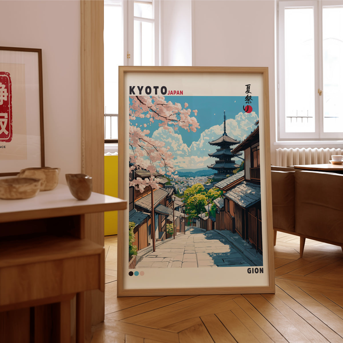 Kyoto Gion cherry blossom street print in an oak frame on the parquet floor of a sunlit living room