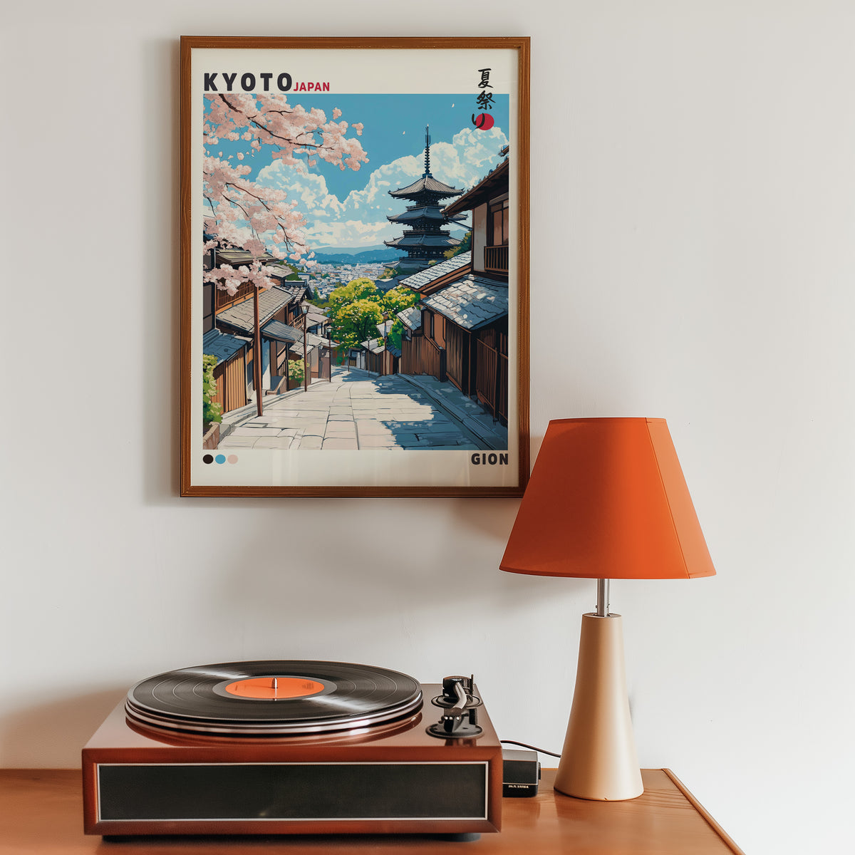 Kyoto Gion cherry blossom street print in a walnut frame above a sideboard with a record player