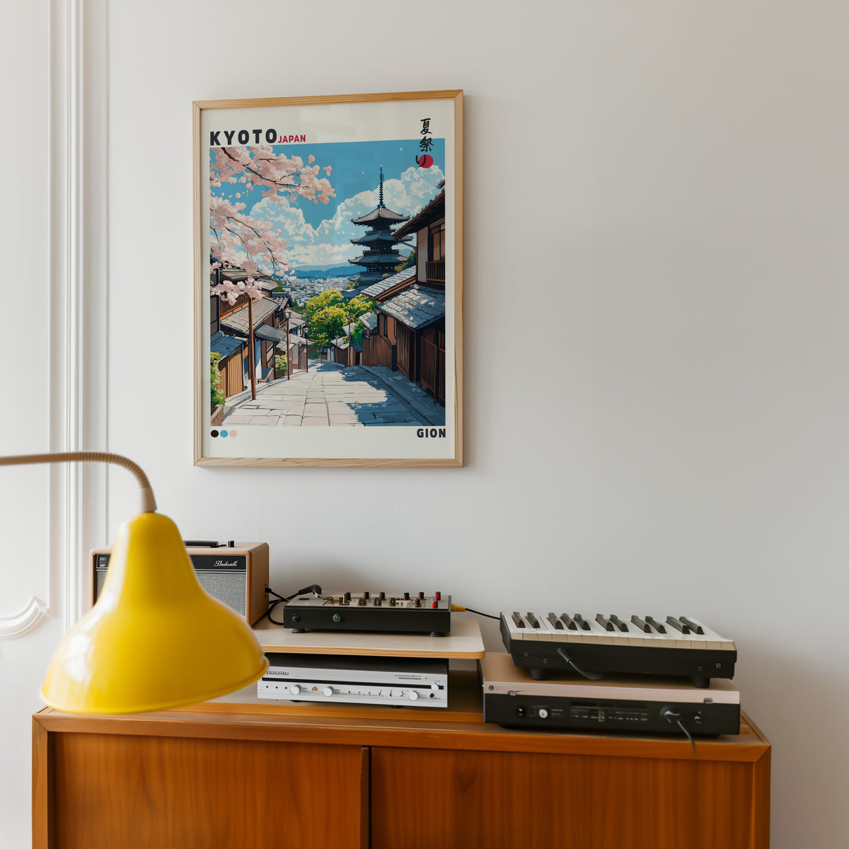 Kyoto Gion cherry blossom street print in an oak frame above a teak sideboard with vintage hi-fi