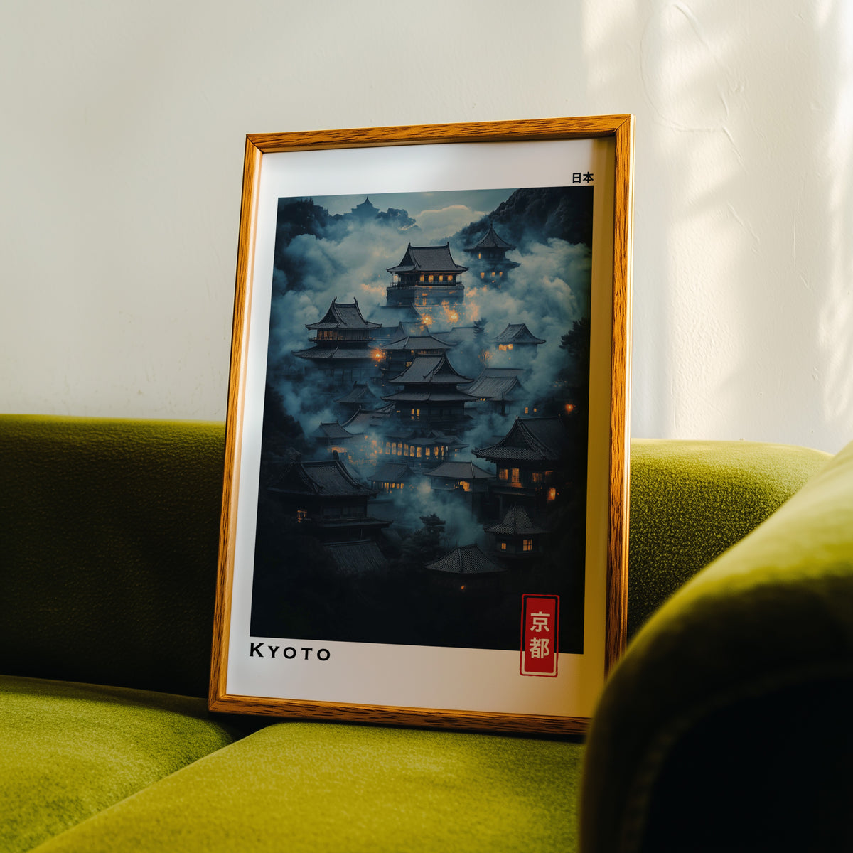 Kyoto misty night temples print in an oak frame propped on a green velvet sofa