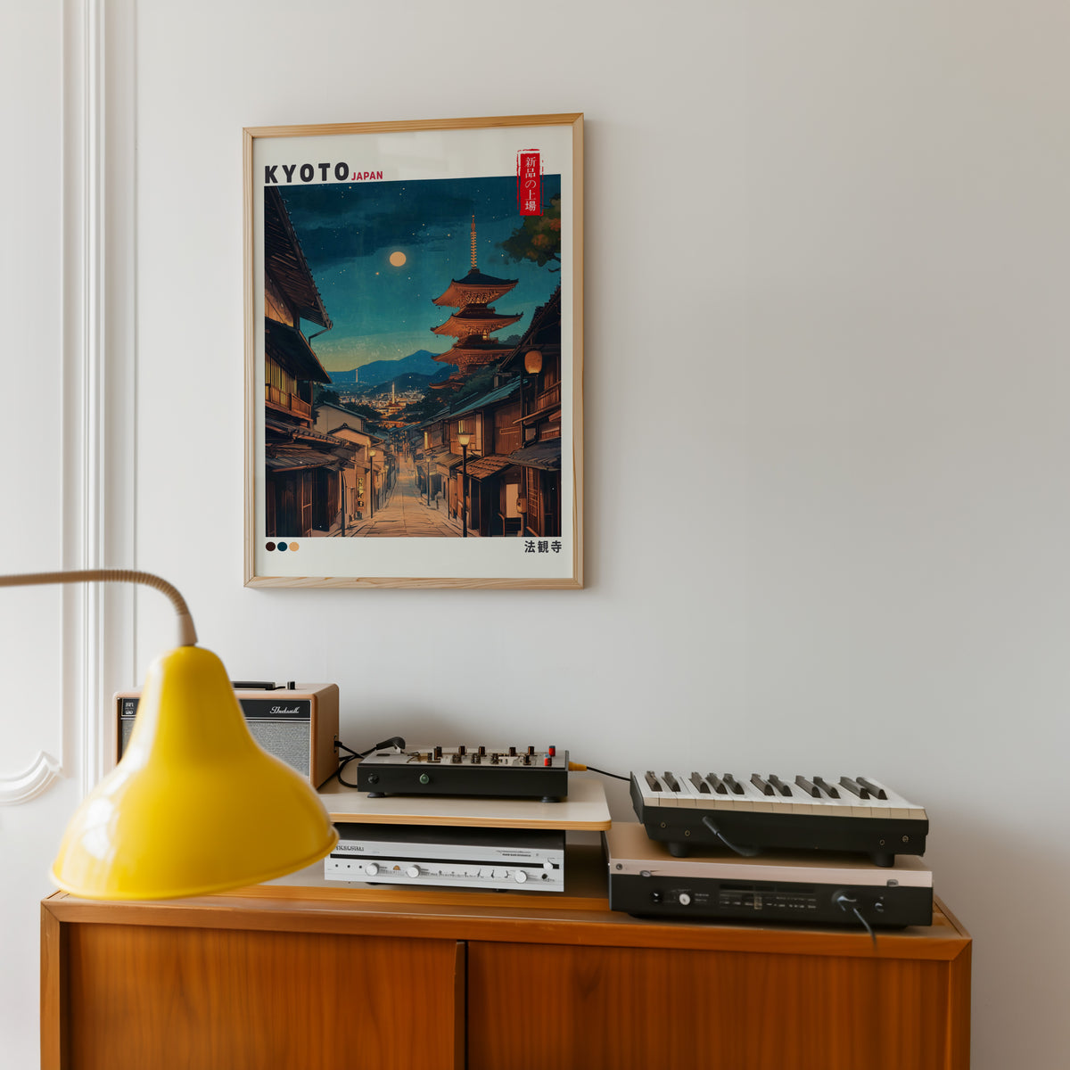 Kyoto night street and Yasaka pagoda print in an oak frame above a teak sideboard with vintage hi-fi