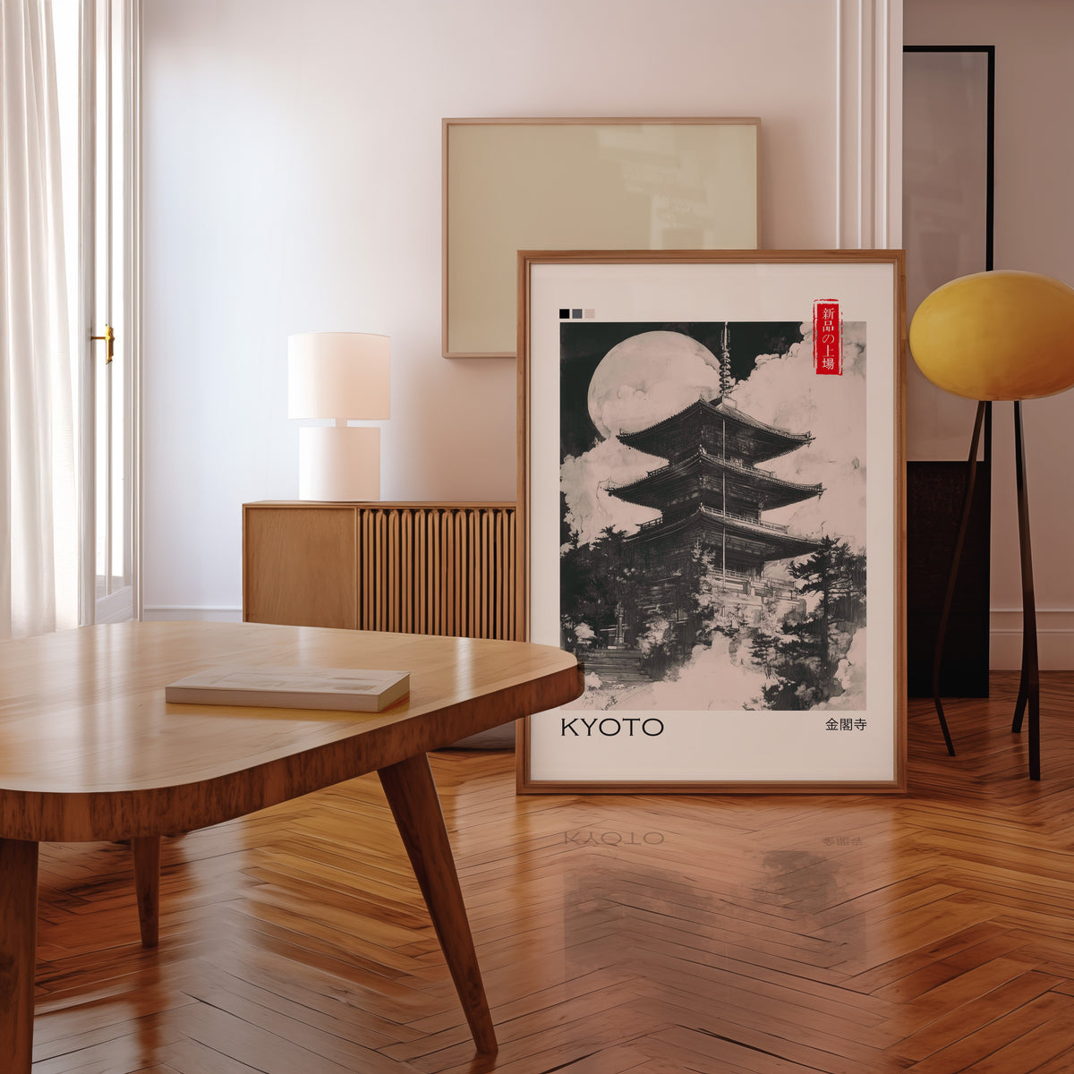 Kyoto ink pagoda and full moon print in a walnut frame leaning in a mid-century living room