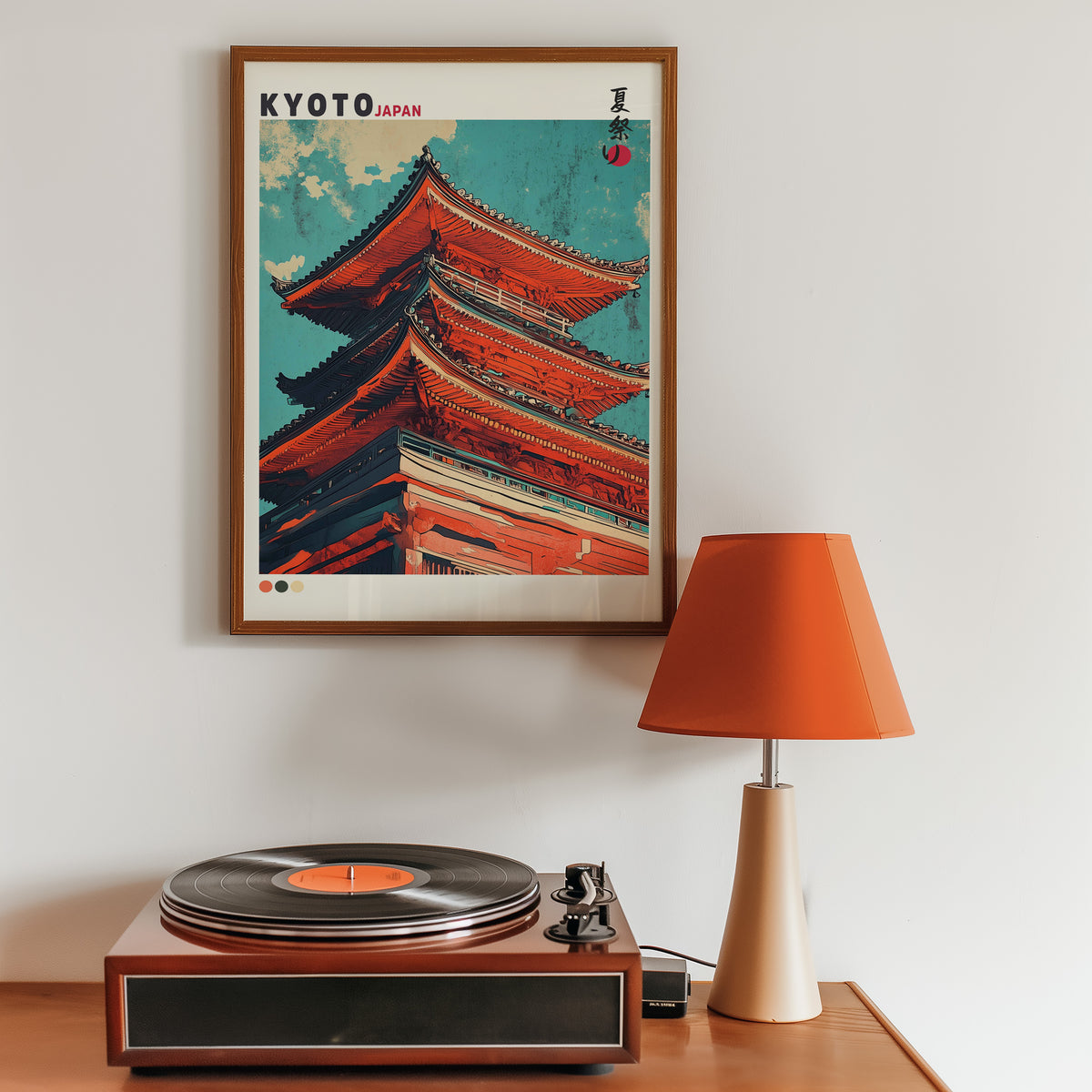 Red pagoda roofs under teal sky print in a walnut frame above a sideboard with a record player
