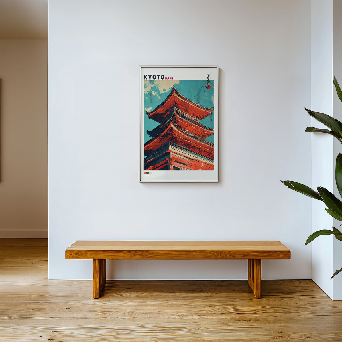 Red pagoda roofs under teal sky print shown in a white frame above a wooden entryway bench