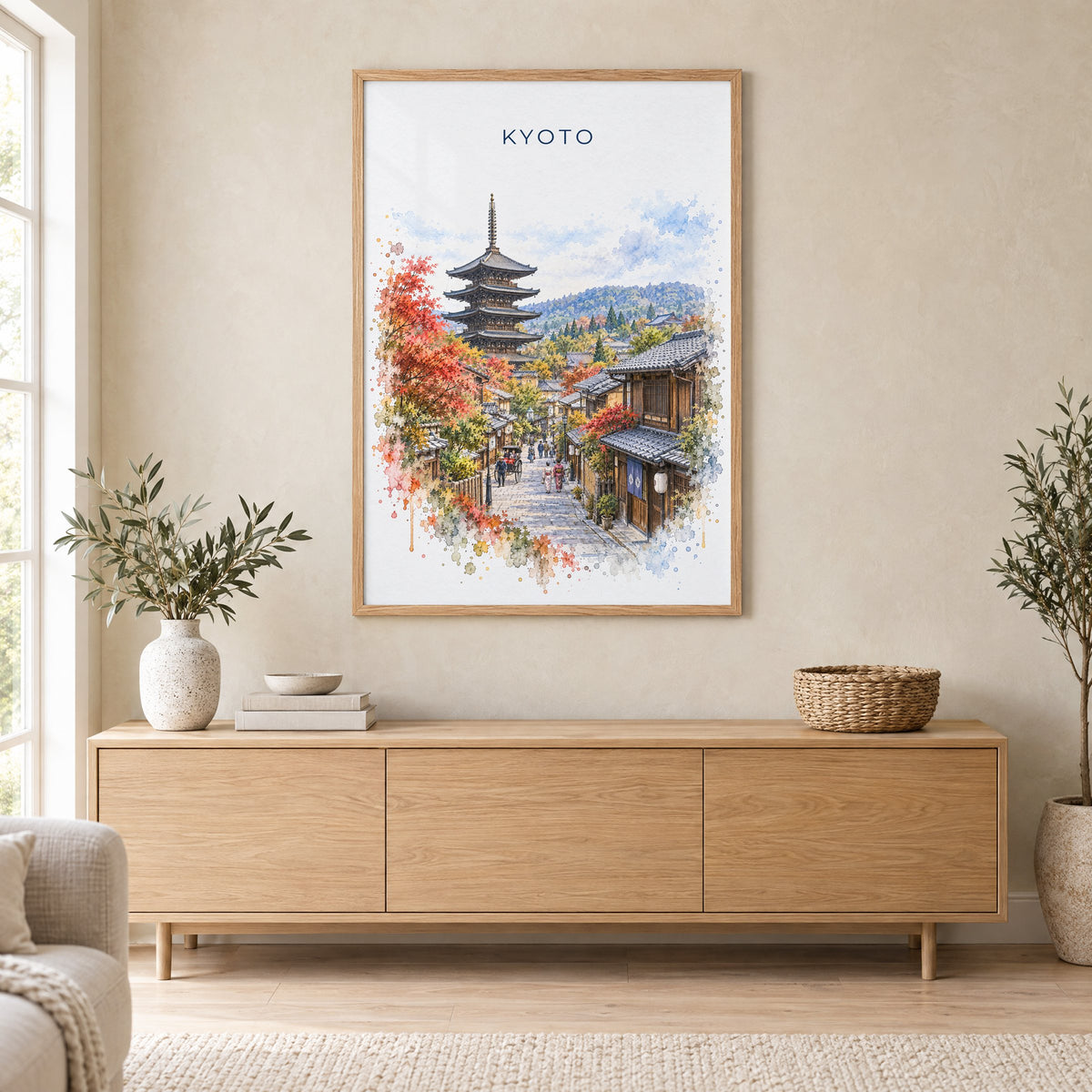 Kyoto watercolor print in an oak frame above a light wood sideboard in a Scandinavian living room