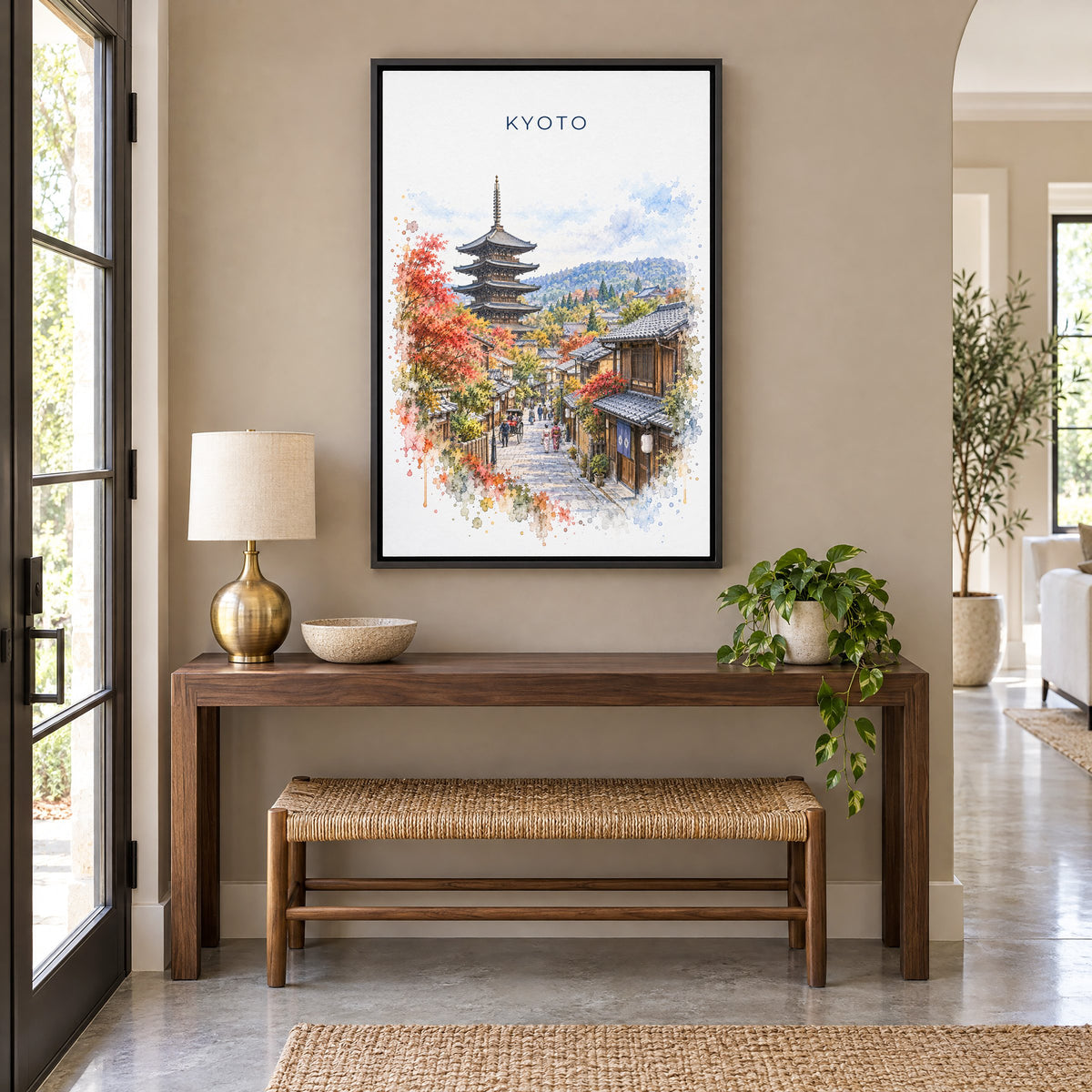 Kyoto watercolor print as a black floater canvas above a walnut console and woven bench in an entryway