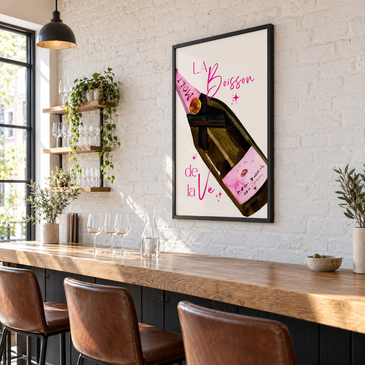 La Boisson champagne bottle watercolor print in a black frame on a white brick wall above a wine bar counter