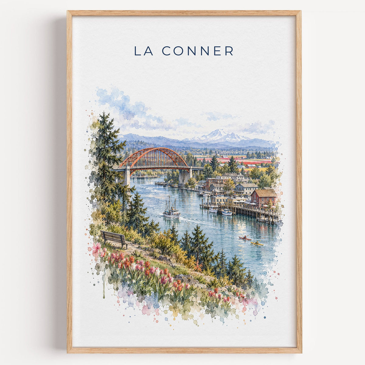 La Conner, Washington watercolor print in a light oak frame on a plain white wall