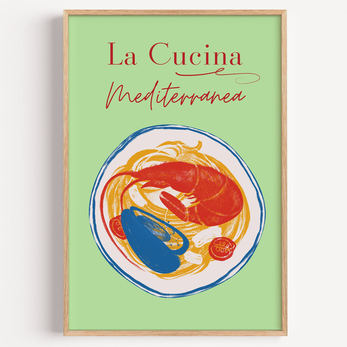 La Cucina Mediterranea seafood pasta print in a light oak frame on a plain white wall