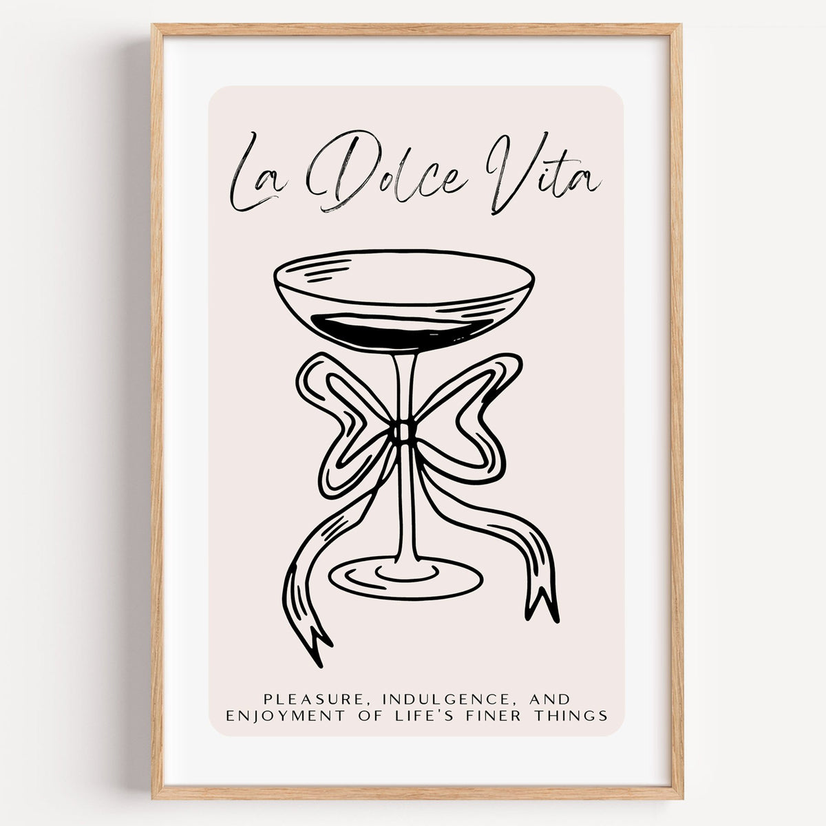 La Dolce Vita black line coupe print in a light oak frame on a plain white wall