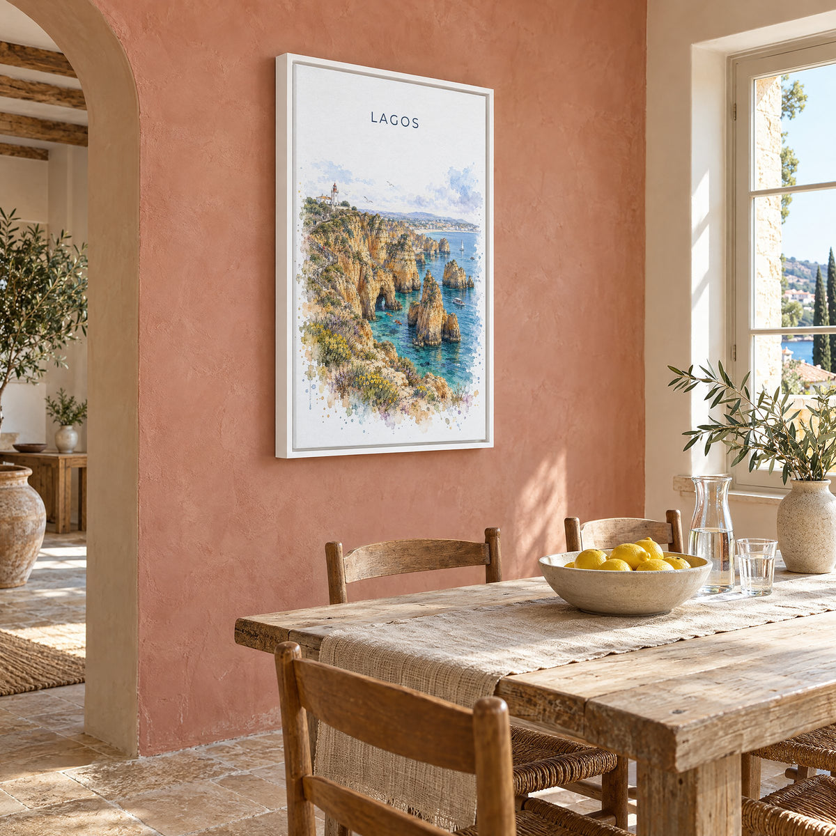 Lagos, Portugal watercolor print as a white floater canvas on a terracotta wall above a rustic dining table