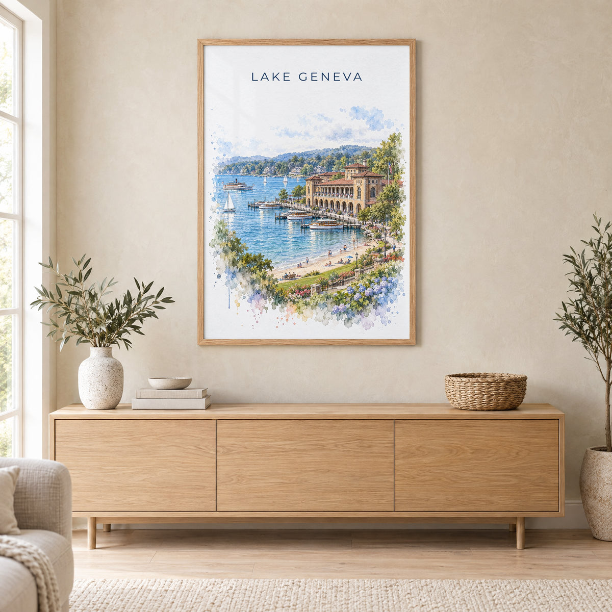 Lake Geneva, Wisconsin watercolor print in an oak frame above a light wood sideboard in a Scandinavian living room
