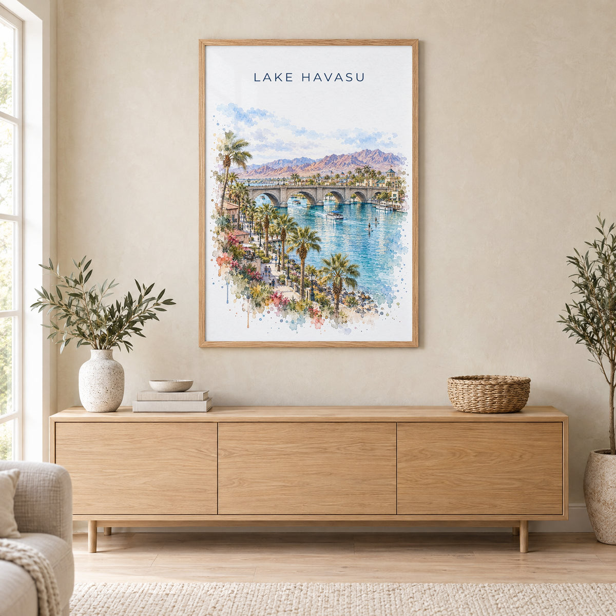 Lake Havasu watercolor print in an oak frame above a light wood sideboard in a Scandinavian living room