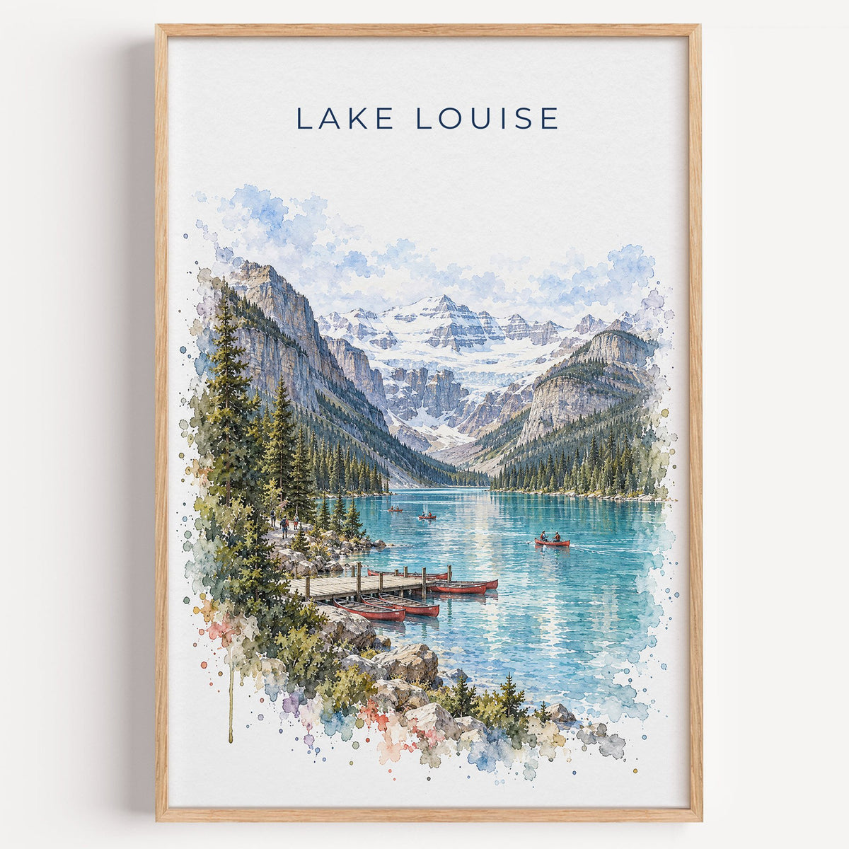 Lake Louise watercolor print in a light oak frame on a plain white wall
