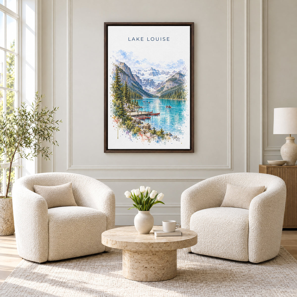 Lake Louise watercolor print as an espresso floater canvas above two boucle armchairs in a hotel lounge