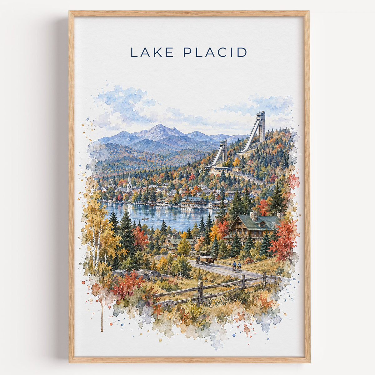 Lake Placid watercolor print in a light oak frame on a plain white wall