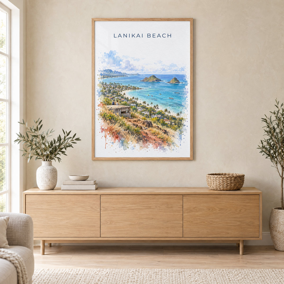 Lanikai Beach watercolor print in an oak frame above a light wood sideboard in a Scandinavian living room
