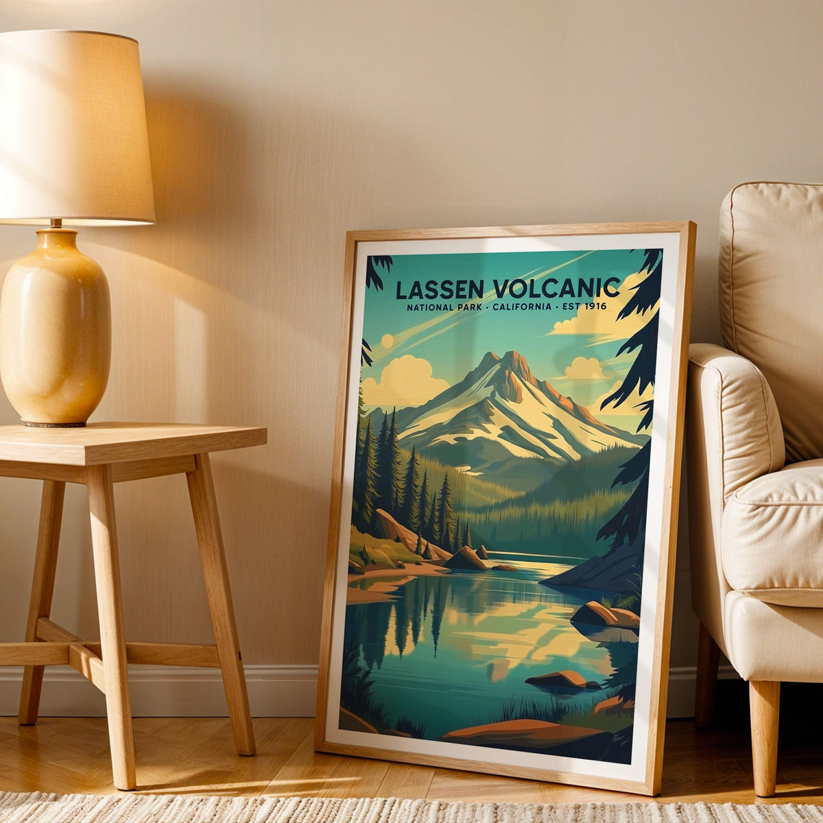 Lassen Volcanic print in an oak frame beside a cream armchair and an amber lamp in warm afternoon light