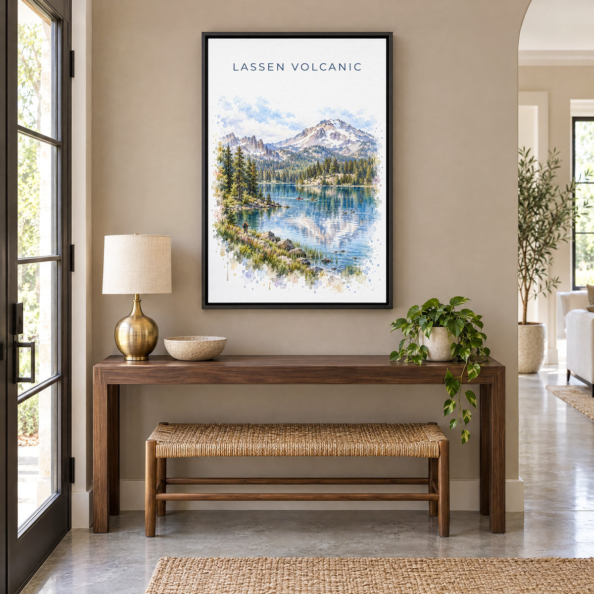 Lassen Volcanic National Park watercolor as a black floater canvas above a walnut console and woven bench in an entryway