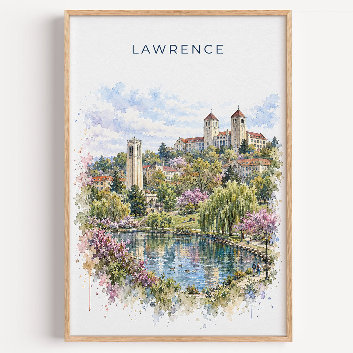 Lawrence, Kansas watercolor print in a light oak frame on a plain white wall