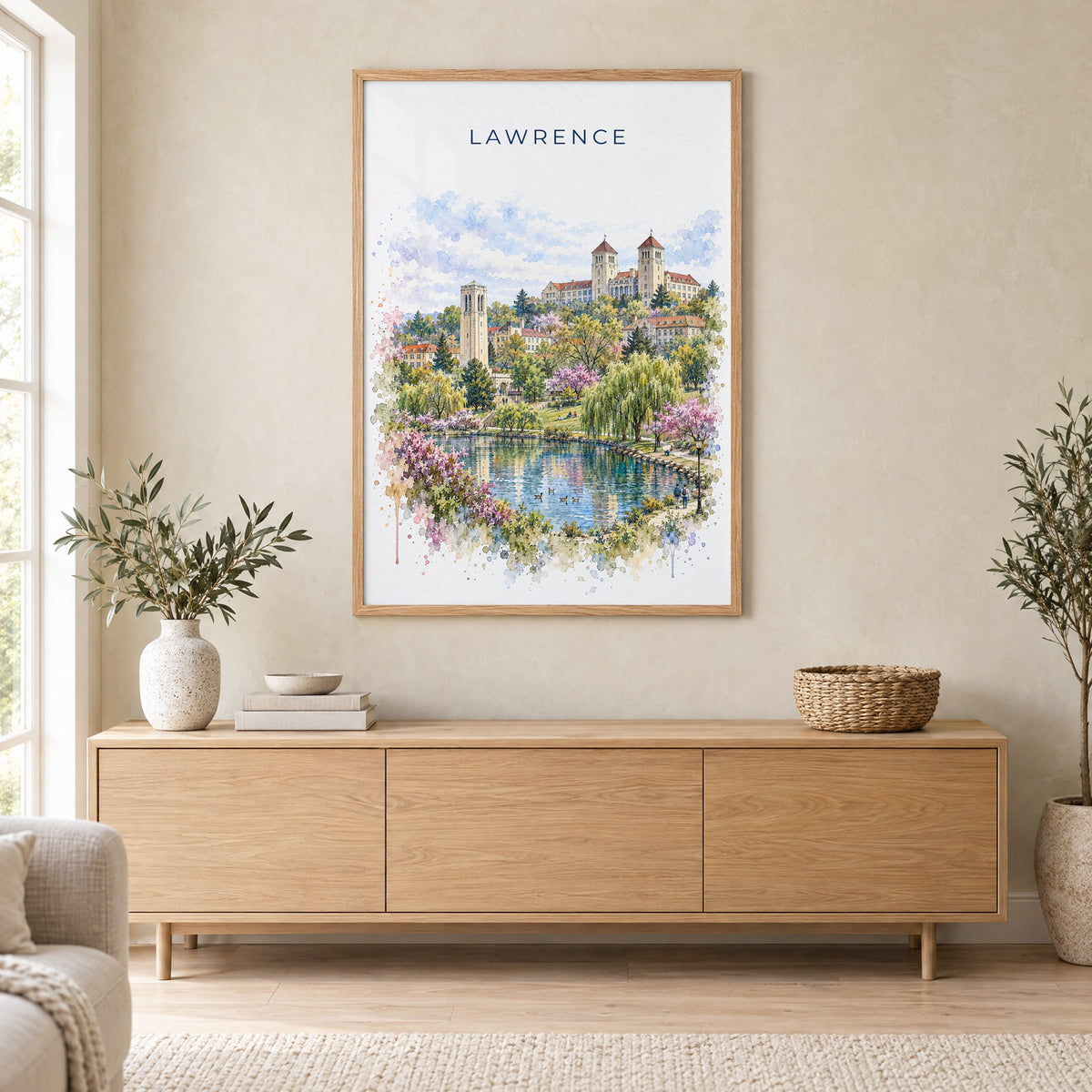 Lawrence, Kansas watercolor print in an oak frame above a light wood sideboard in a Scandinavian living room