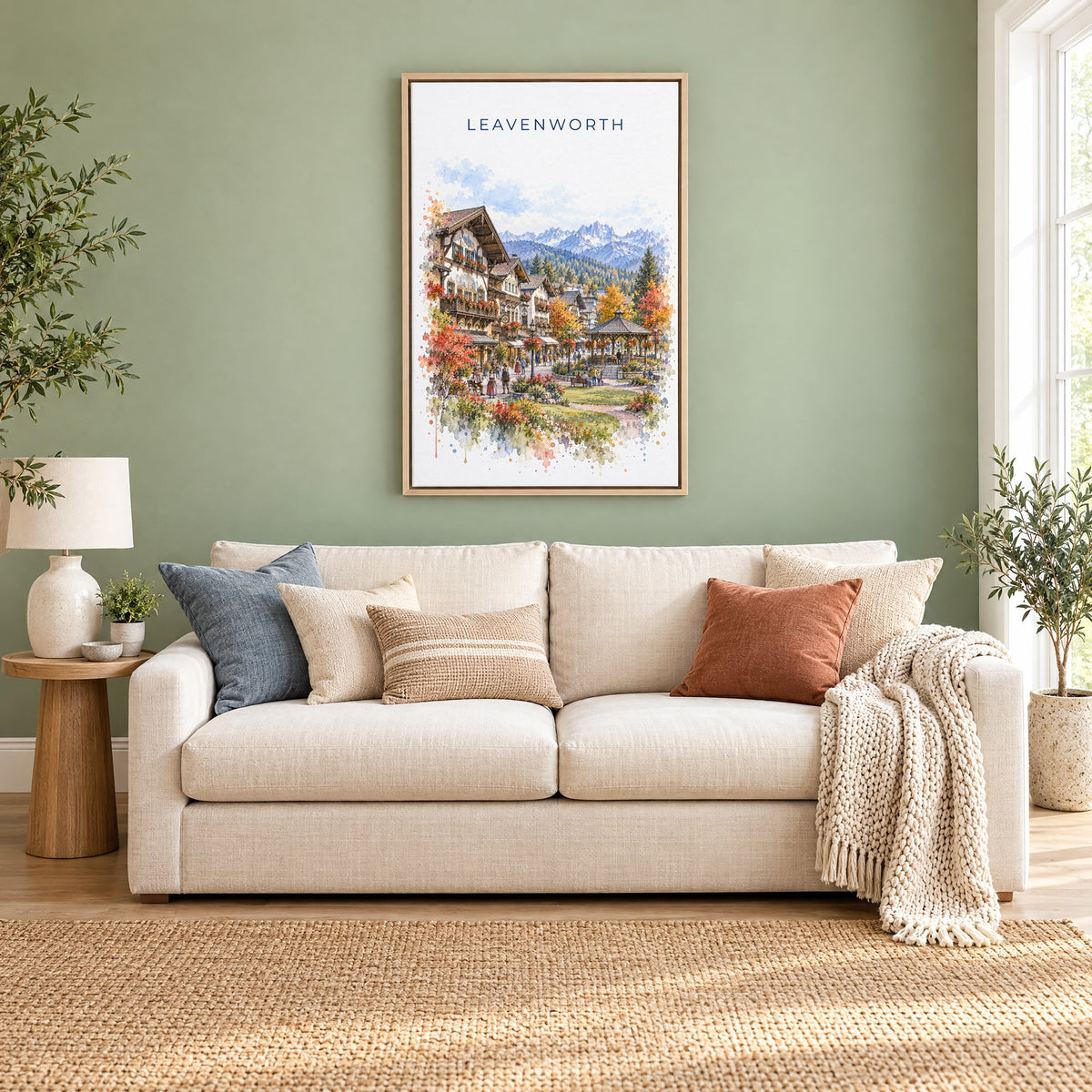 Leavenworth watercolor print as a natural floater canvas above a cream linen sofa on a sage green wall