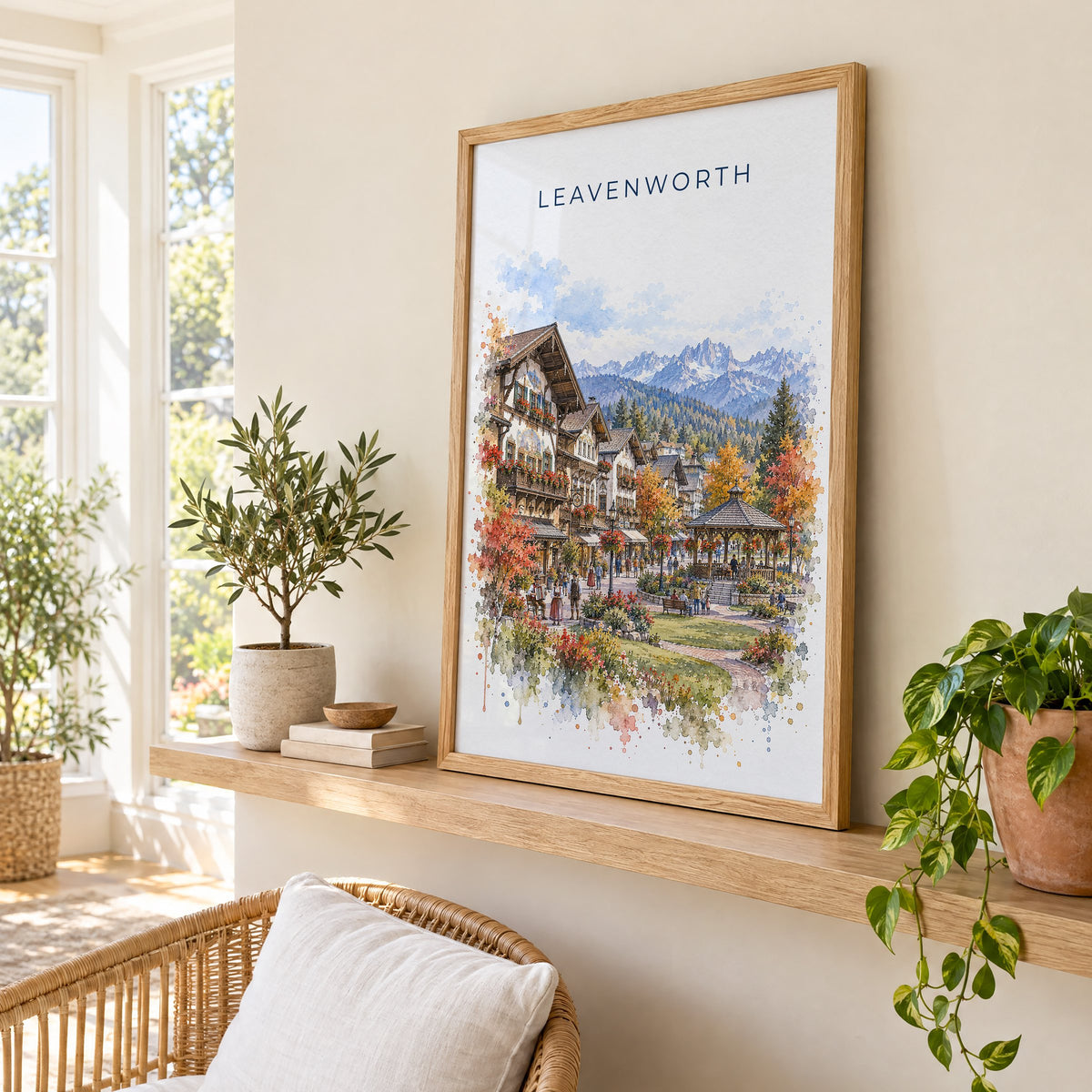 Leavenworth watercolor print in an oak frame on a picture ledge in a sunlit sunroom