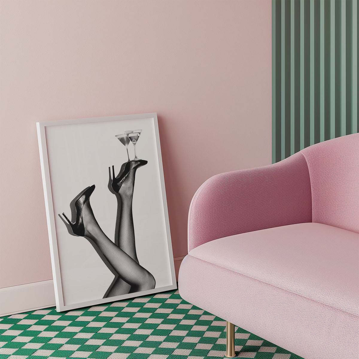 Legs in heels balancing two martini glasses print in a white frame beside a pink armchair on a checkered floor