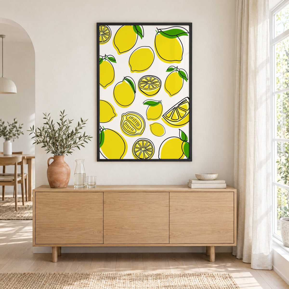 Lemon line art offset pattern print in a black frame above an oak sideboard with a terracotta vase of olive branches