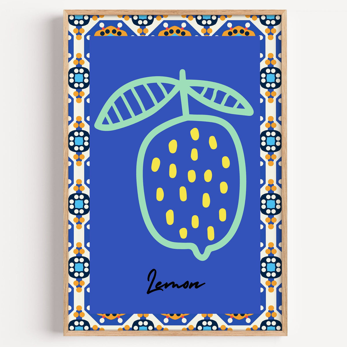 Lemon mint outline cobalt tile print in a light oak frame on a plain white wall