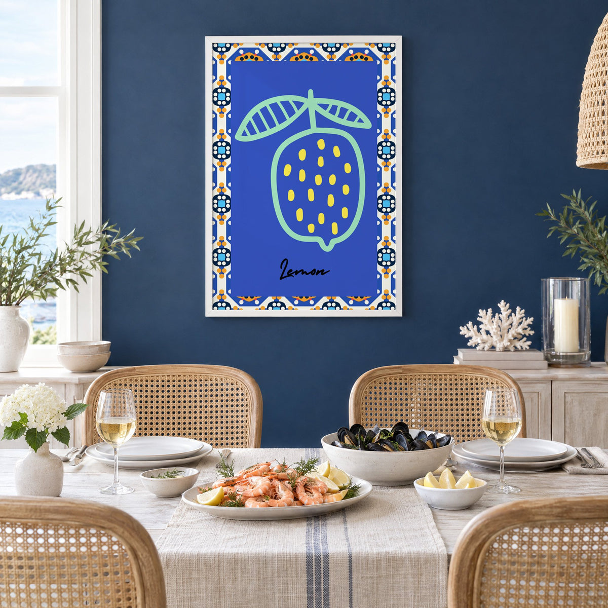 Lemon mint outline cobalt tile print in a white frame on a navy wall above a dining table set with shrimp and mussels
