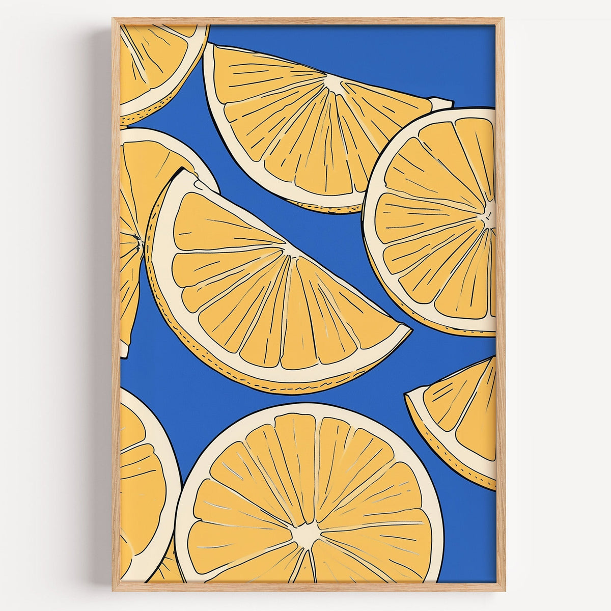 Lemon slice pattern print in a light oak frame on a plain white wall