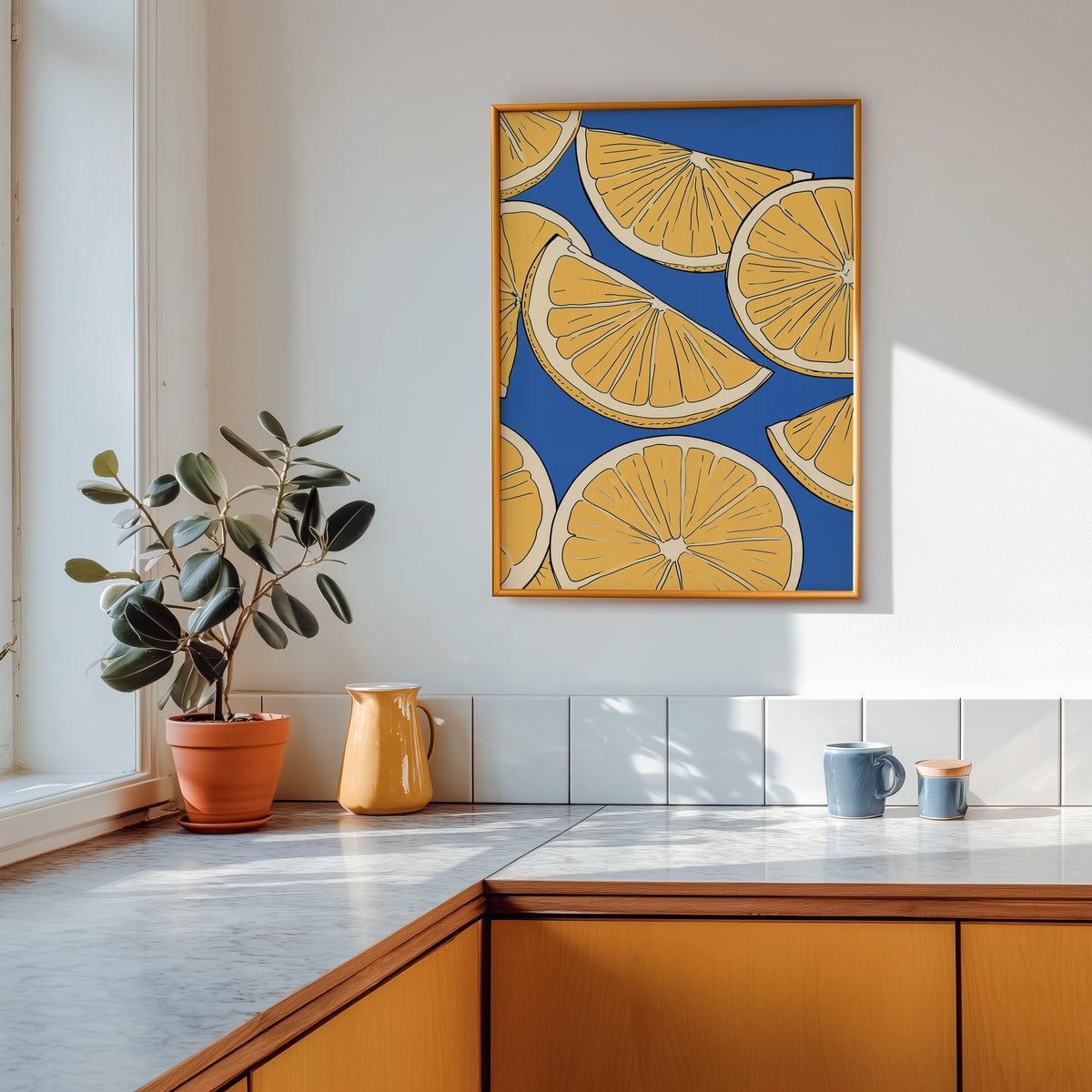 Lemon slice pattern print shown in a gold frame above a marble counter in a tan kitchen