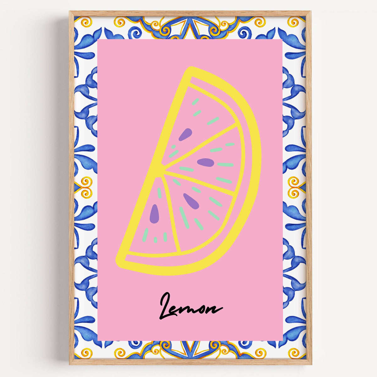 Lemon slice pink majolica tile print in a light oak frame on a plain white wall
