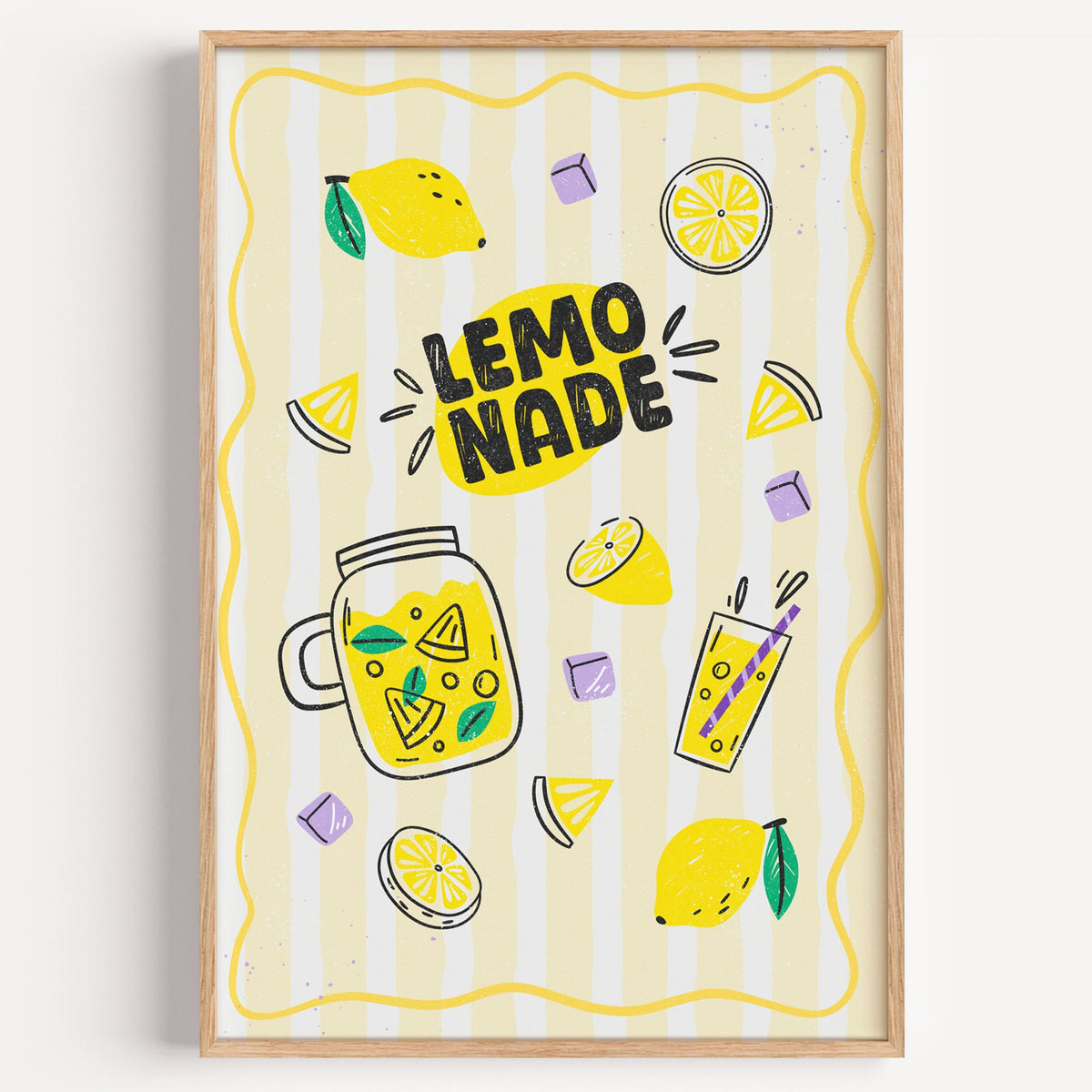 Lemonade print in a light oak frame on a plain white wall