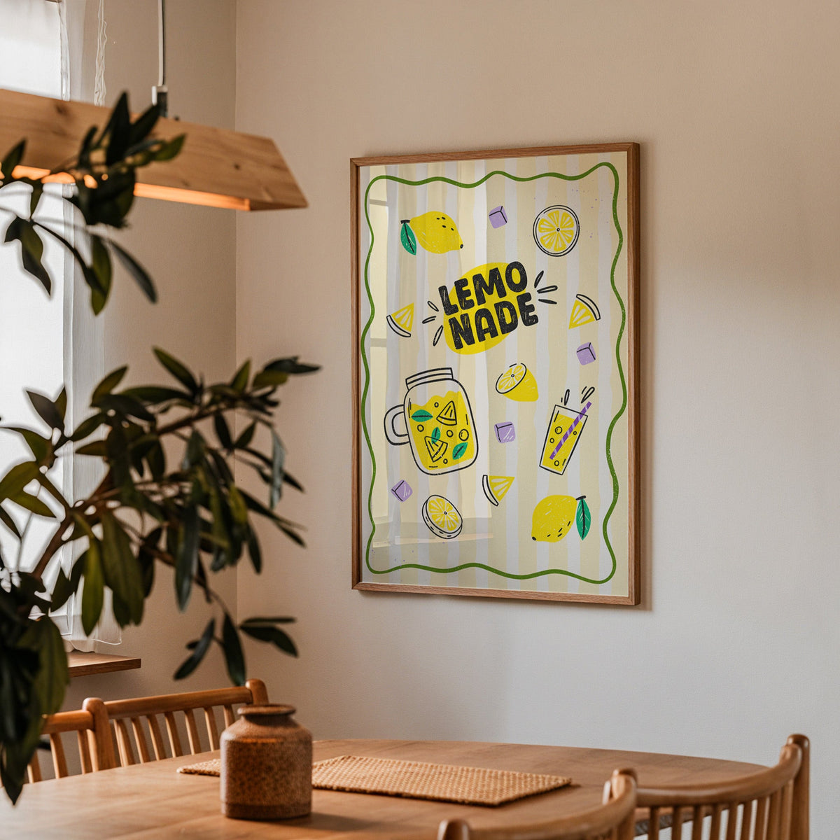 Lemonade Stand print in a walnut frame above a dining table with olive branches