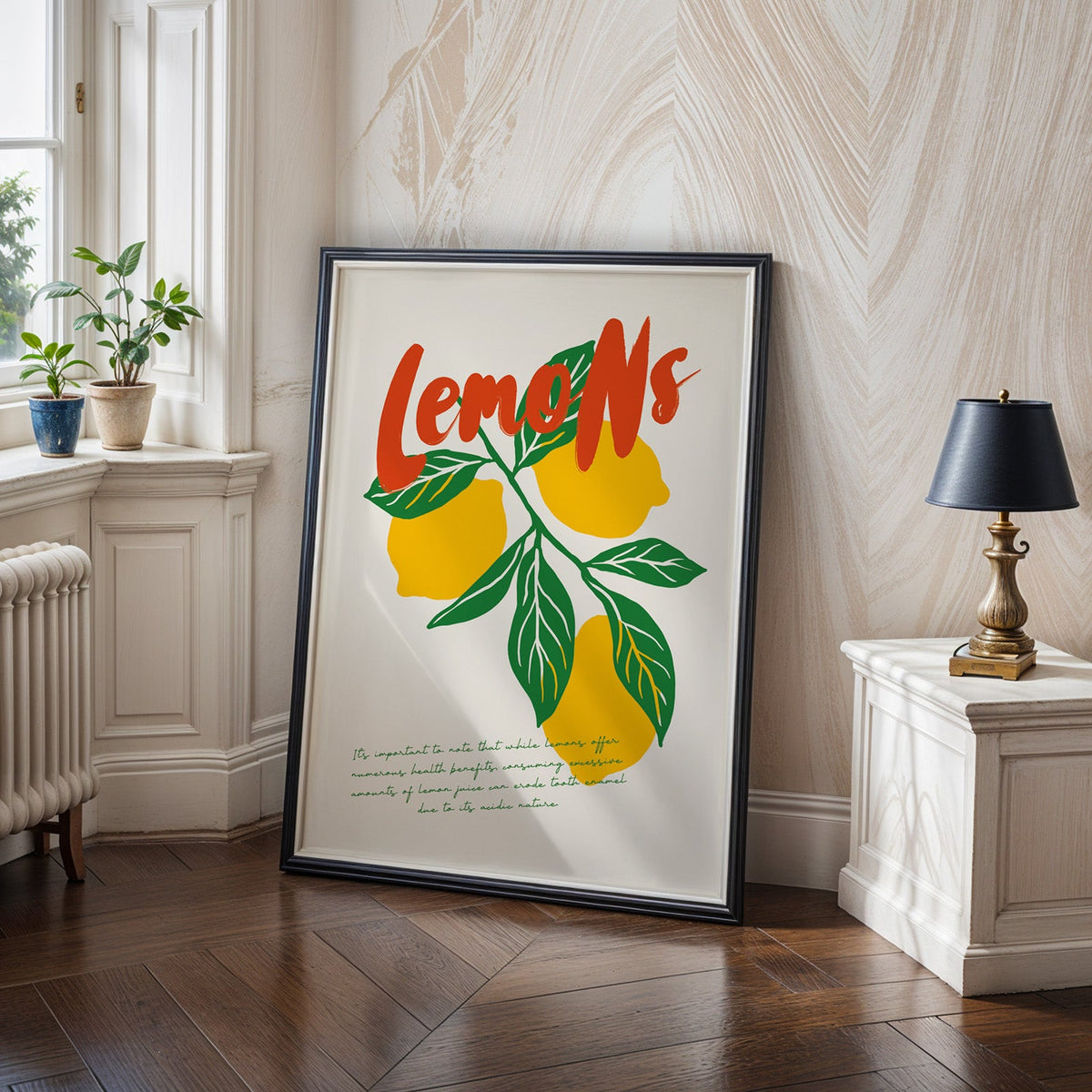 Lemons poster in a black frame leaning on a herringbone wood floor in a panelled hallway