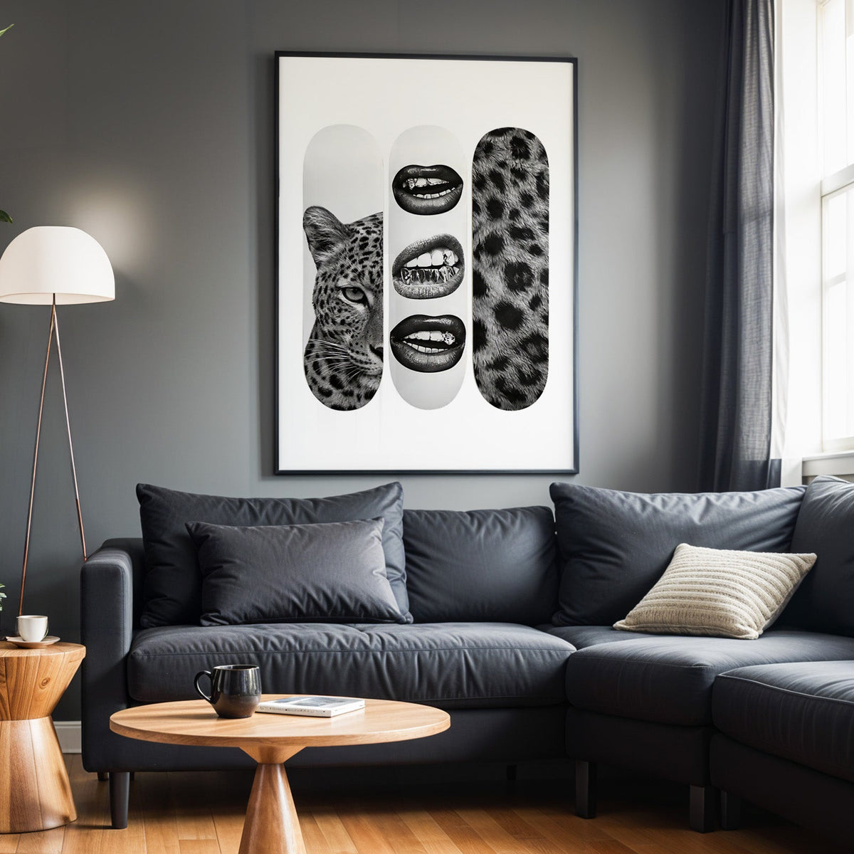 Three skateboards: leopard face, grillz lips, fur print in a black frame above a charcoal sofa on a grey wall